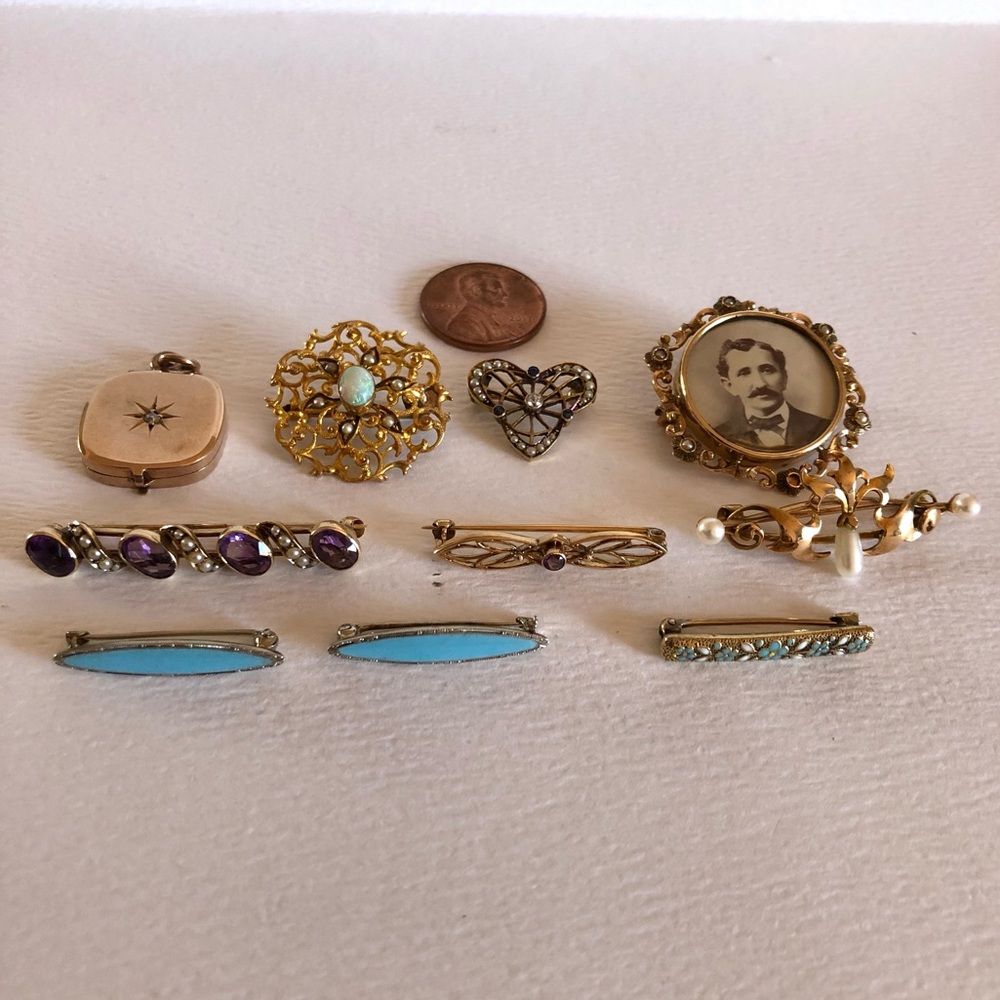 Group of 14k brooches and one 10k locket charm